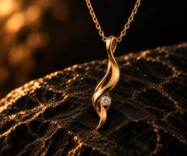 The Signature Pendant, the Fight to Play line in gold with a single stone